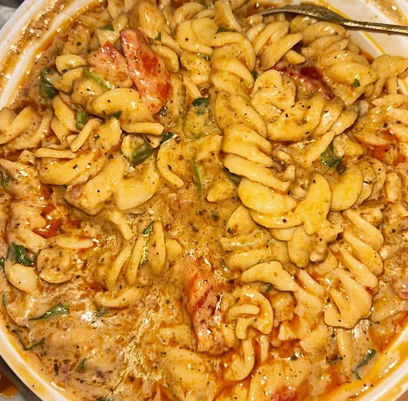 Indian-style pasta with tomato, onion and garam masala at Pind Di Roti in Toronto